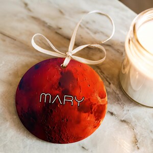 A space gift ornament of planet Mars with a custom name.