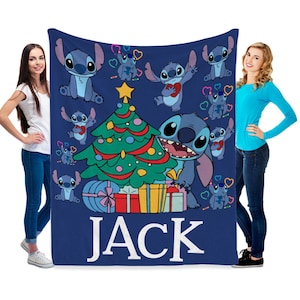 May include: Blue fleece blanket with a Christmas tree and Stitch characters. The blanket has the name "JACK" printed on it.