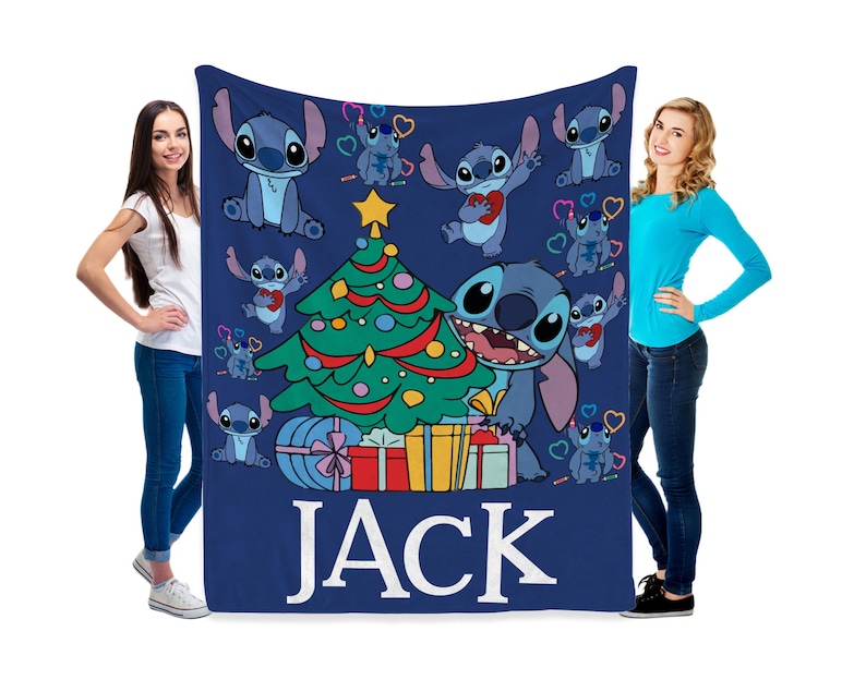 May include: Blue fleece blanket with a Christmas tree and Stitch characters. The blanket has the name "JACK" printed on it.