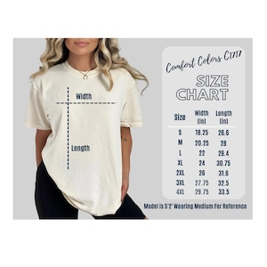 May include: Cream-colored t-shirt with a size chart and the text "Comfort Colors C1717." The size chart shows measurements in inches for width and length, ranging from size S to 4XL. The model is 5'2" and wearing a medium.