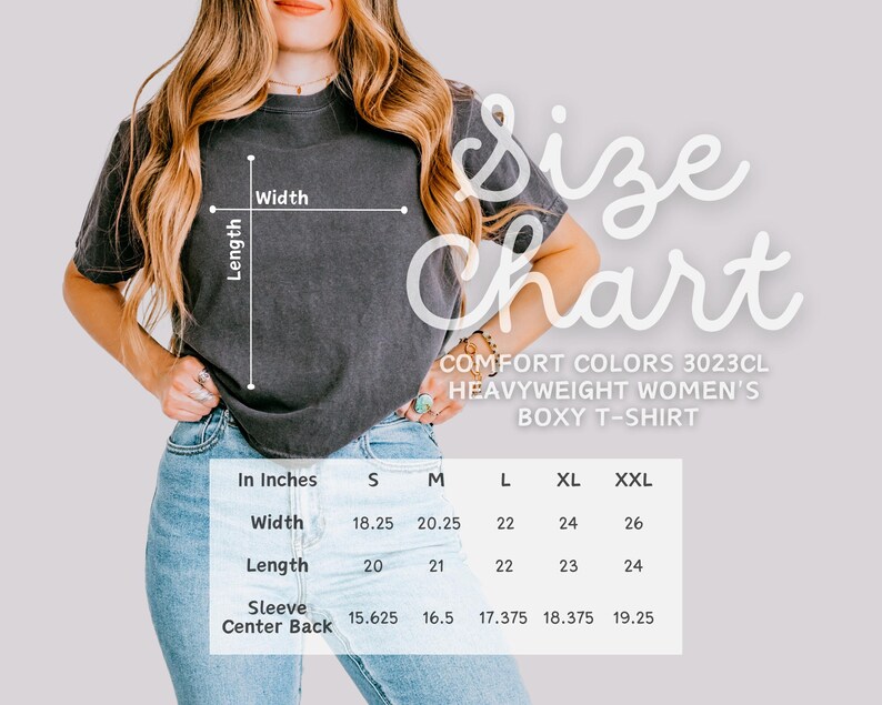 May include: A charcoal gray Comfort Colors 3023CL heavyweight boxy t-shirt. The image includes a size chart with measurements in inches for width, length, and sleeve center back. The chart shows sizes S, M, L, XL, and XXL.