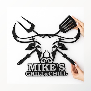 Custom metal BBQ name sign with bull head and grilling tools, personalized wall decor for outdoor kitchen.