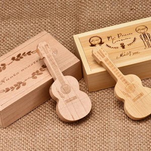 May include: Two wooden boxes with guitar shaped USB drives. One box has the text "Nunca nada te" engraved on it. The other box has the text "Mr. Princess & Miss Queen" engraved on it.