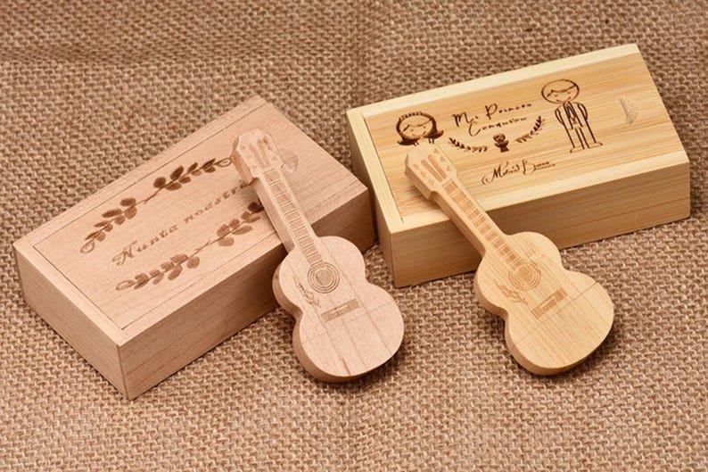 May include: Two wooden boxes with guitar shaped USB drives. One box has the text "Nunca nada te" engraved on it. The other box has the text "Mr. Princess & Miss Queen" engraved on it.