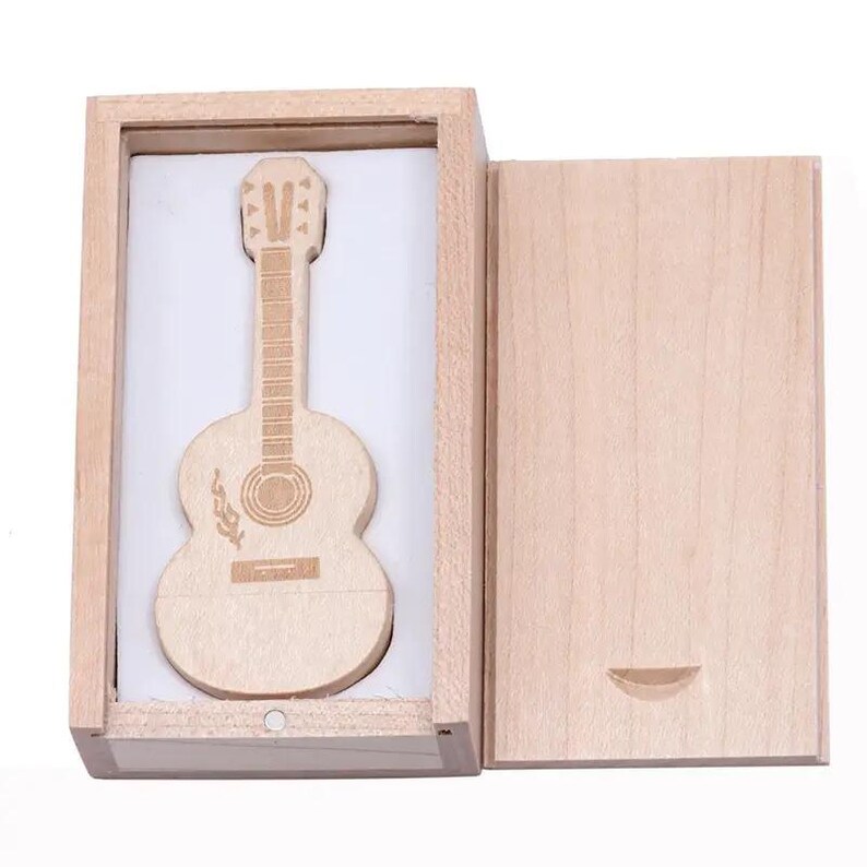 May include: A wooden guitar-shaped USB flash drive in a wooden box with a hinged lid. The guitar has a detailed design and is a unique and stylish way to store data.