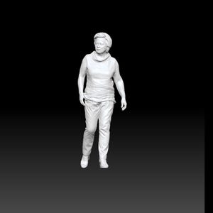 May include: A white 3D-printed figurine of a person with short hair, wearing a sleeveless top with a high neckline and long trousers. The figure is standing in a neutral pose. The text IE_067 is visible in a small black box at the bottom.