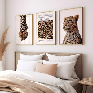 May include: Three framed prints with a leopard theme. The left print shows a close-up of a leopard paw with a diamond bracelet. The center print features a leopard print pattern with the text "The Leopard" and "Weekly Highlight". The right print shows a leopard with a diamond necklace.