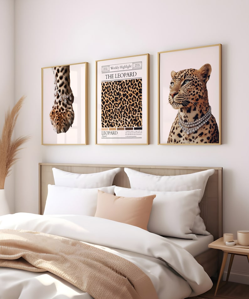 May include: Three framed prints with a leopard theme. The left print shows a close-up of a leopard paw with a diamond bracelet. The center print features a leopard print pattern with the text "The Leopard" and "Weekly Highlight". The right print shows a leopard with a diamond necklace.