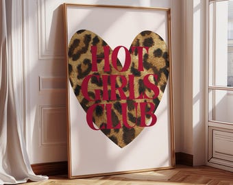 May include: A pink and white print with a leopard print heart shape. The text "HOT GIRLS CLUB" is written in red letters over the heart.