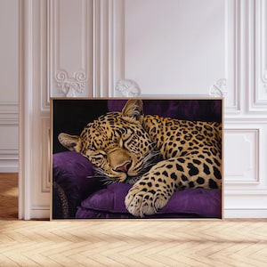 May include: A close-up of a leopard sleeping on a plush purple cushion. The leopard's fur is a mix of brown, black, and yellow spots. The cushion is in a luxurious setting.
