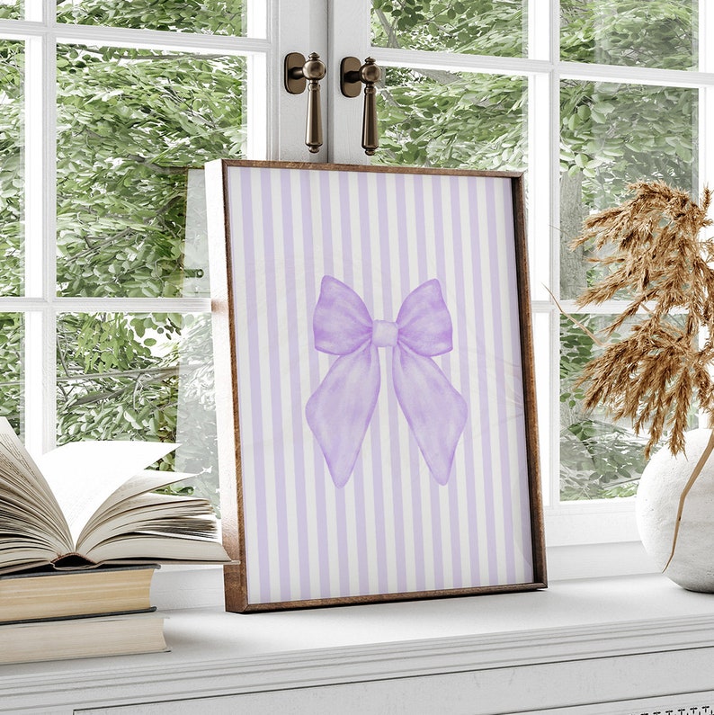 May include: A purple watercolor bow on a white and purple striped background. The bow is tied in a knot and the ends are flowing. The background is a simple striped pattern.