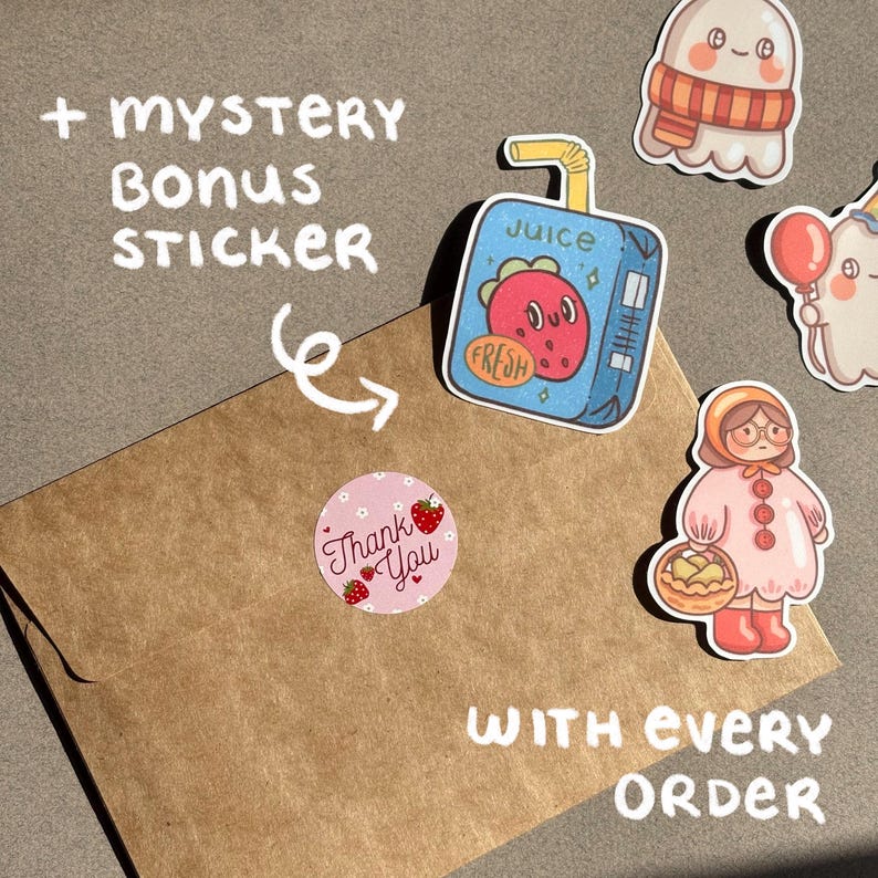 May include: An assortment of colorful stickers, including a juice box with a strawberry design, a ghost with a scarf, and a girl with a basket. A brown envelope is shown with a pink "Thank You" sticker and text that reads "+ Mystery Bonus Sticker" and "With Every Order".