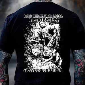 May include: Black t-shirt with a graphic illustration in white. The illustration depicts a violent scene with the text "CURB STOMP YOUR LOCAL PEDOPHILE!" and "#SAVETHECHILDREN". The shirt has a crew neck.