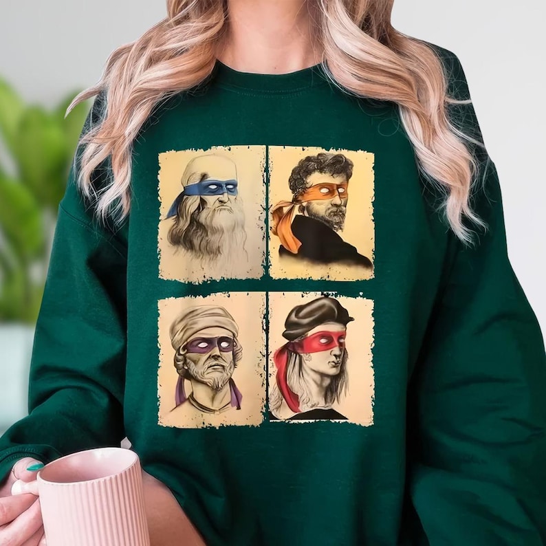A person wearing a green sweatshirt with four square images depicting different cartoon-style portraits of men with distinctive features.