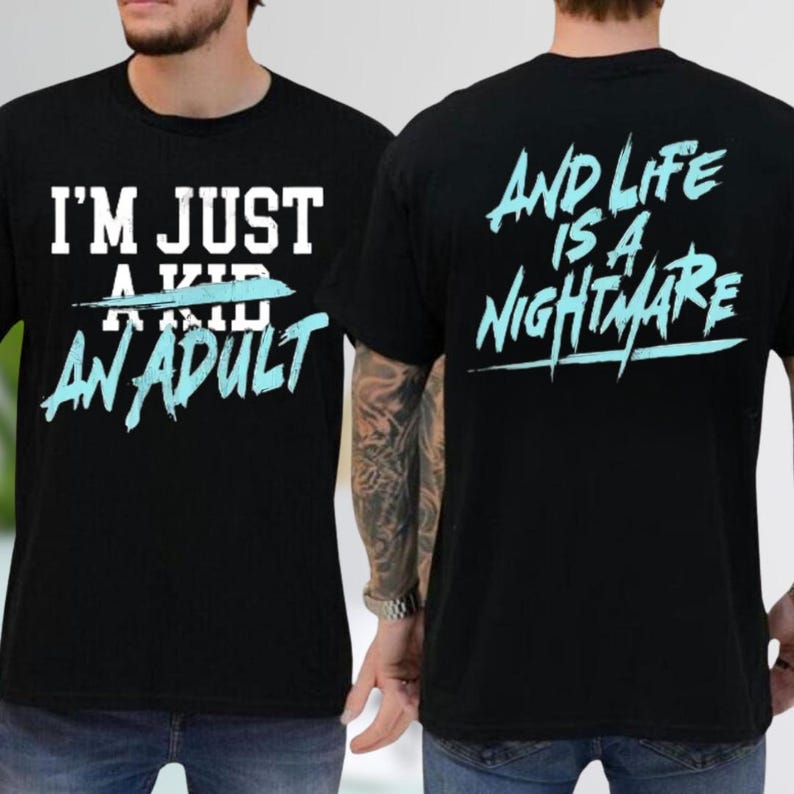 two people wearing black t-shirts with white and teal text and graphics.