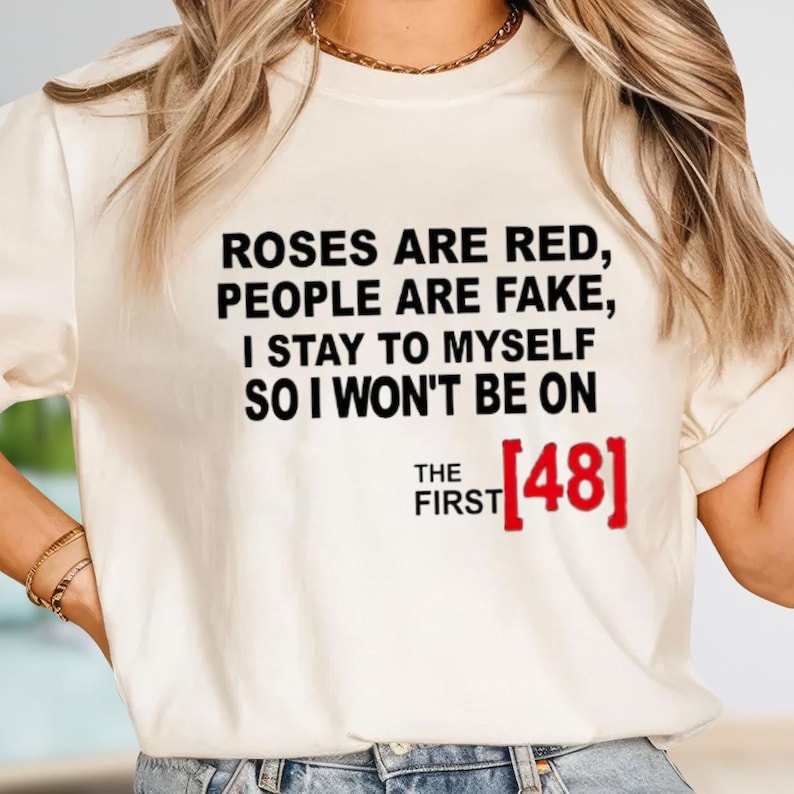 A white t-shirt with text printed on it.