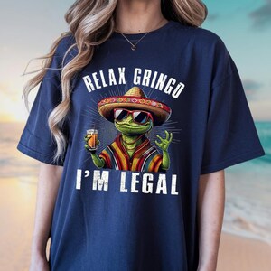 a woman wearing a t - shirt that says relax gringo i'm legal