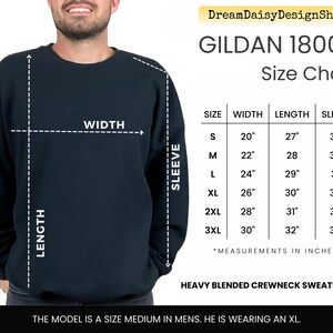 The image is a size chart for a GILDA 18000 crew neck sweatshirt, which is a heavy blended crew neck sweatshirt. The chart provides measurements for the width, sleeve length, sleeve length, and sleeve length in inches. The model is described as a size medium in men, and he is wearing an XL. The image is a collage of multiple images, and the text is concise and avoids redundancy.