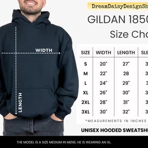 The image is a size chart for a GILDA 18500 hooded sweatshirt, which is a medium-sized men's hooded sweatshirt. The chart provides measurements for the width, sleeve length, and length of the sweatshirt in inches. The model is described as a size medium in men, and he is wearing an XL size. The image is a collage of multiple images, and the text is concise and avoids redundancy.
