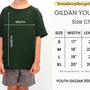 A person wearing a green t-shirt and gray shorts, with a size chart for the t-shirt displayed next to them.