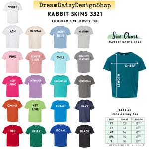 The image is a size chart for a rabbit skins 3321 toddler fine jersey t-shirt, featuring a variety of different colored t-shirts in the sizes of 2T, 3T, 4T, 5T, 6T, 7T, and 8T.