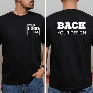 May include: Black t-shirt with white text that says "YOUR LOGO HERE" on the front and "BACK YOUR DESIGN" on the back. The t-shirt is a crew neck style and appears to be made of a soft material.