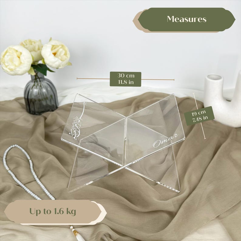 May include: Clear acrylic book stand with a personalized name "Omar" engraved on it. The stand is 11.5 inches tall and 7.48 inches wide. It can hold up to 1.6 kg.