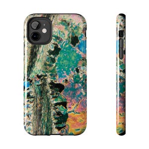 May include: A smartphone case with a colorful, abstract design. The case features a black camera cutout and a vibrant pattern of blues, greens, pinks, and yellows. The side view shows the same pattern wrapping around the phone.