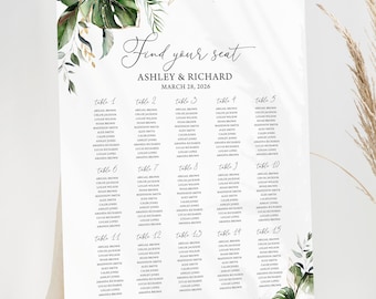 May include: A white wedding seating chart with green tropical leaves and the text "Find your seat Ashley & Richard March 24, 2026" at the top. The chart lists tables 1 through 15 with guest names.