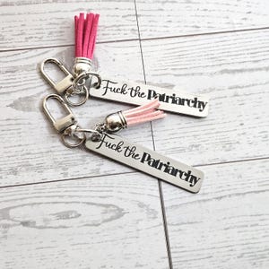 Fuck the Patriarchy Keychain – Engraved Stainless Steel Bar with Pink Tassel – Feminist Statement Charm