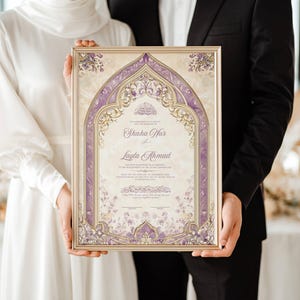 May include: A framed wedding certificate with a gold border and ornate purple floral design. The certificate features the names "Shaha War" and "Layla Ahmad" in elegant script. The couple holds the framed certificate.