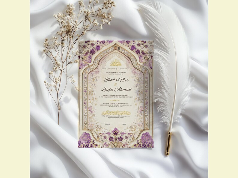 May include: An ornate wedding invitation with the names Shaha Nur and Layla Ahmad, featuring a floral design in purple and gold. The invitation is set against a white background with a feather and dried flowers.