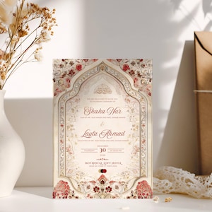 Puede incluir: Una invitaci&oacute;n de boda ornamentada con elementos florales y arquitect&oacute;nicos. La invitaci&oacute;n presenta los nombres "Shaha Nur" y "Layla Ahmad", junto con la fecha "30 de diciembre de 2026". La paleta de colores incluye crema, rojo y dorado.