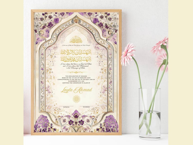 May include: A framed certificate with floral and geometric patterns in purple, gold, and cream. The certificate features Arabic script and the name "Layla Ahmad". A vase of pink flowers is to the right.