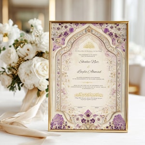May include: A framed wedding invitation with gold trim, featuring the names "Shaha Nur & Layla Ahmad." The design includes floral and ornamental details in purple and gold, with text in Arabic script. A bouquet of white flowers is in the background.