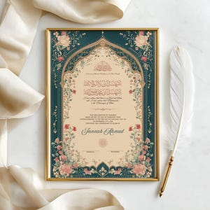May include: A framed certificate with ornate floral and scrollwork borders in teal, cream, and gold. The certificate features Arabic calligraphy and the name "Jannah Ahmad". A white feather with a gold tip rests beside the frame.