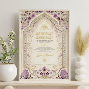May include: Framed Islamic certificate with ornate floral and geometric designs in gold, cream, and purple. The certificate includes Arabic calligraphy and the name "Layla Ahmad". Decorative vase with flowers and pampas grass.
