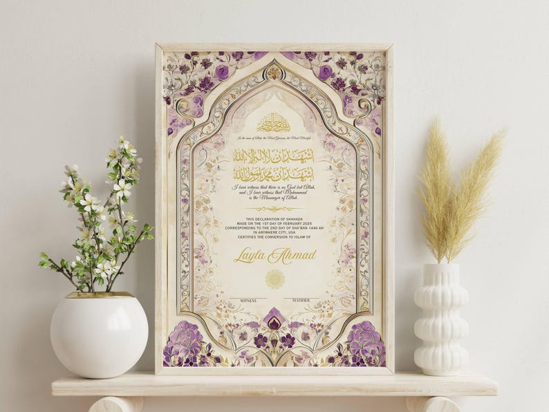 May include: Framed Islamic certificate with ornate floral and geometric designs in gold, cream, and purple. The certificate includes Arabic calligraphy and the name "Layla Ahmad". Decorative vase with flowers and pampas grass.