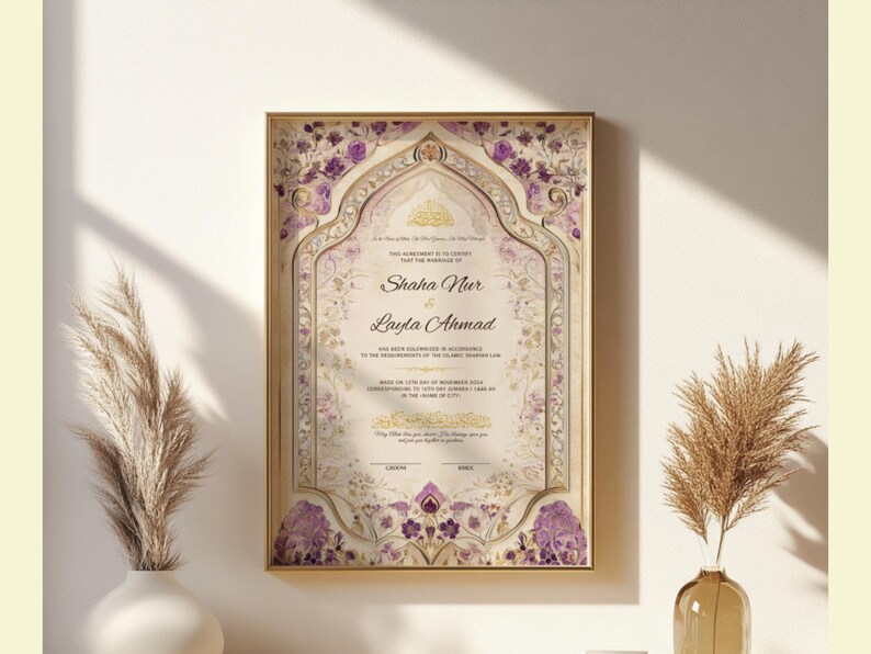 May include: Framed wedding certificate with gold trim, featuring floral and ornate design elements in purple and gold. The names "Shaha Nur" and "Layla Ahmad" are prominently displayed. The certificate is displayed on a white wall with decorative plants.