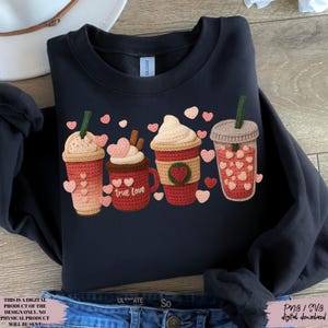 May include: Navy blue sweatshirt featuring a crochet design of four coffee drinks with heart accents. One mug says "true love". The design includes pink and red hearts, and the text "THIS IS A DIGITAL PRODUCT OF THE DESIGN ONLY. NO PHYSICAL PRODUCT WILL BE SENT".