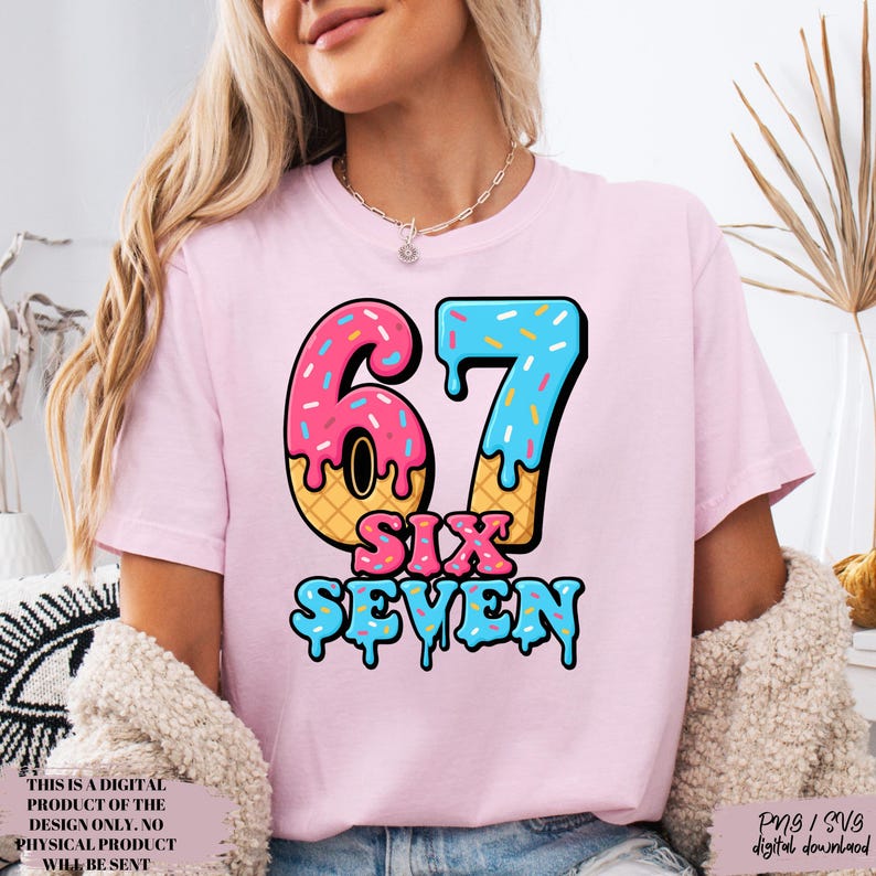 May include: A light pink t-shirt with a colorful graphic of the number "67" in a donut-style design. The words "SIX SEVEN" are below the number. The shirt also has text that reads "THIS IS A DIGITAL PRODUCT OF THE DESIGN ONLY. NO PHYSICAL PRODUCT WILL BE SENT" and "Png / SVS digital download".