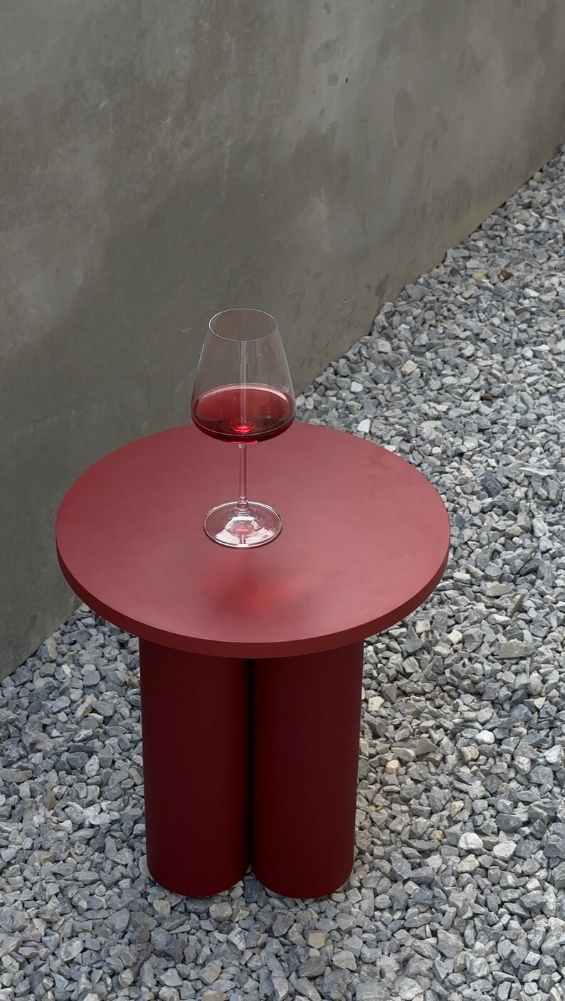 Bring style and function to any space with this compact round accent table