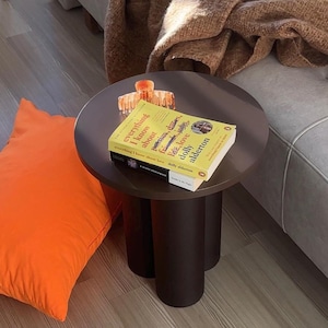 Small round lamp table that adds warmth and character to any corner