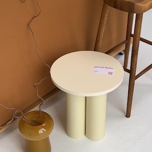 Handcrafted round side table for a touch of charm in any room