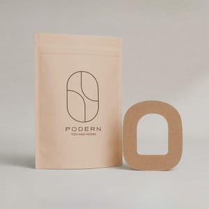 May include: A tan-colored pouch with the word "PODERN" and a geometric design printed in black. Next to it is a brown, arch-shaped cutout. The text "PODS MADE MODERN" is below the brand name.