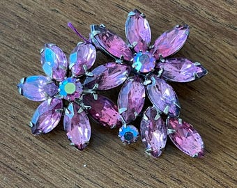 Vintage Rhinestone brooch with pink prong set faceted rhinestones and ab stones. Not signed. Very Good Condition 1950s