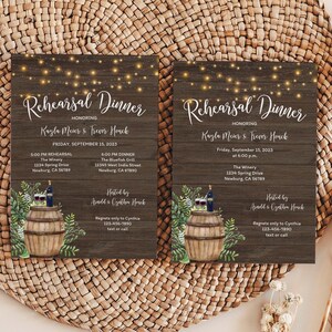 May include: Two rustic wood-grain wedding rehearsal dinner invitations with string lights, a watercolor illustration of a wine barrel with greenery, and the text "Rehearsal Dinner" honoring Kayla Meier & Trevor Houck. The invitations include the date, time, and location of the rehearsal dinner and the dinner.