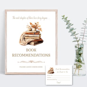 Può includere: Un cartello incorniciato con il testo "The next chapter of their love story begins..." e "BOOK RECOMMENDATIONS". È raffigurata una pila di libri con una coperta e una composizione floreale. Una piccola carta recita "Book Recommendation for Bride-to-Be."