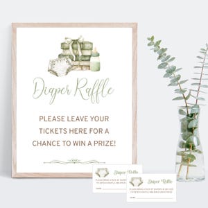 May include: A framed sign with the words "Diaper Raffle" in a script font. The sign includes watercolor illustrations of a diaper, books, and a baby bottle. Below the text are two raffle tickets with the same design.