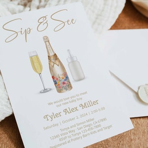 May include: A white invitation card with gold lettering announcing a Sip & See for a new baby boy named Tyler Alex Miller. The invitation includes the date, time, and location of the event, as well as contact information for the hosts. The card features a watercolor illustration of a champagne bottle, a champagne flute, and a baby bottle.